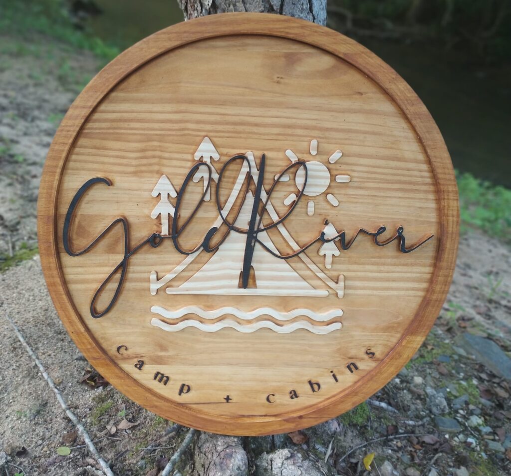 gold camp tree sign